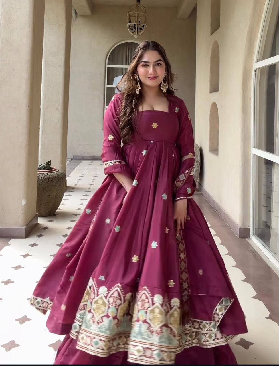 Majestic Wine Flared Anarkali Suit Set Adorned with Delicate Floral Scattered Motifs and an Ornate Heritage Embroidered Border